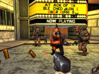 A first-person point of view facing a theater marquee along the exterior of dirty, run-down street. A gun is being held from the foreground, pointed towards the direction of a group of grotesque-looking humanoids approaching the frame.